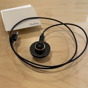 Oura Black and Gold Ring